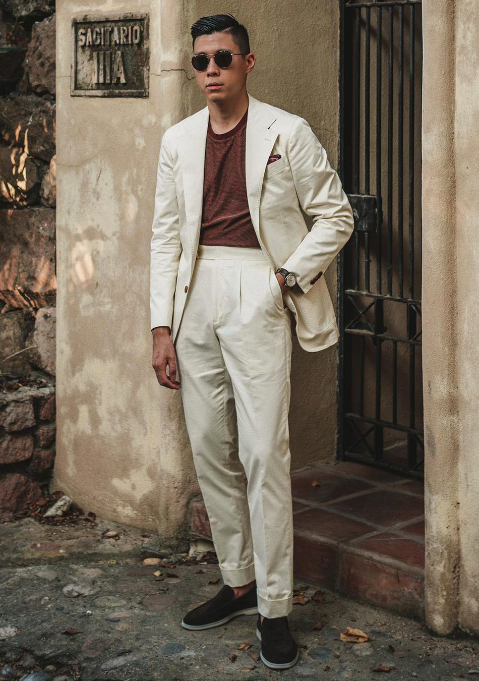 Beige suit, burgundy brown t-shirt, and black loafers