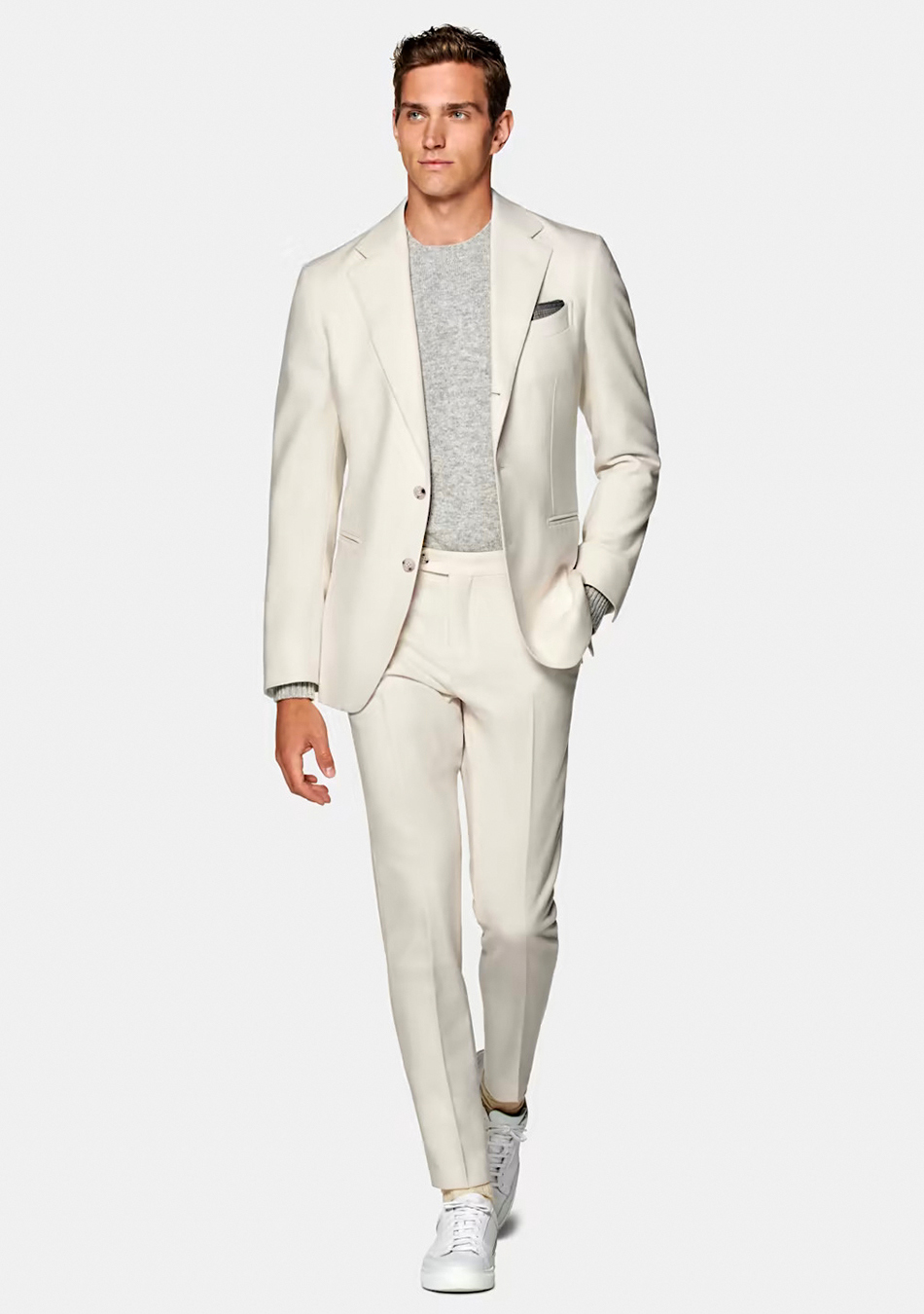 Beige suit, grey crew-neck t-shirt, and white sneakers
