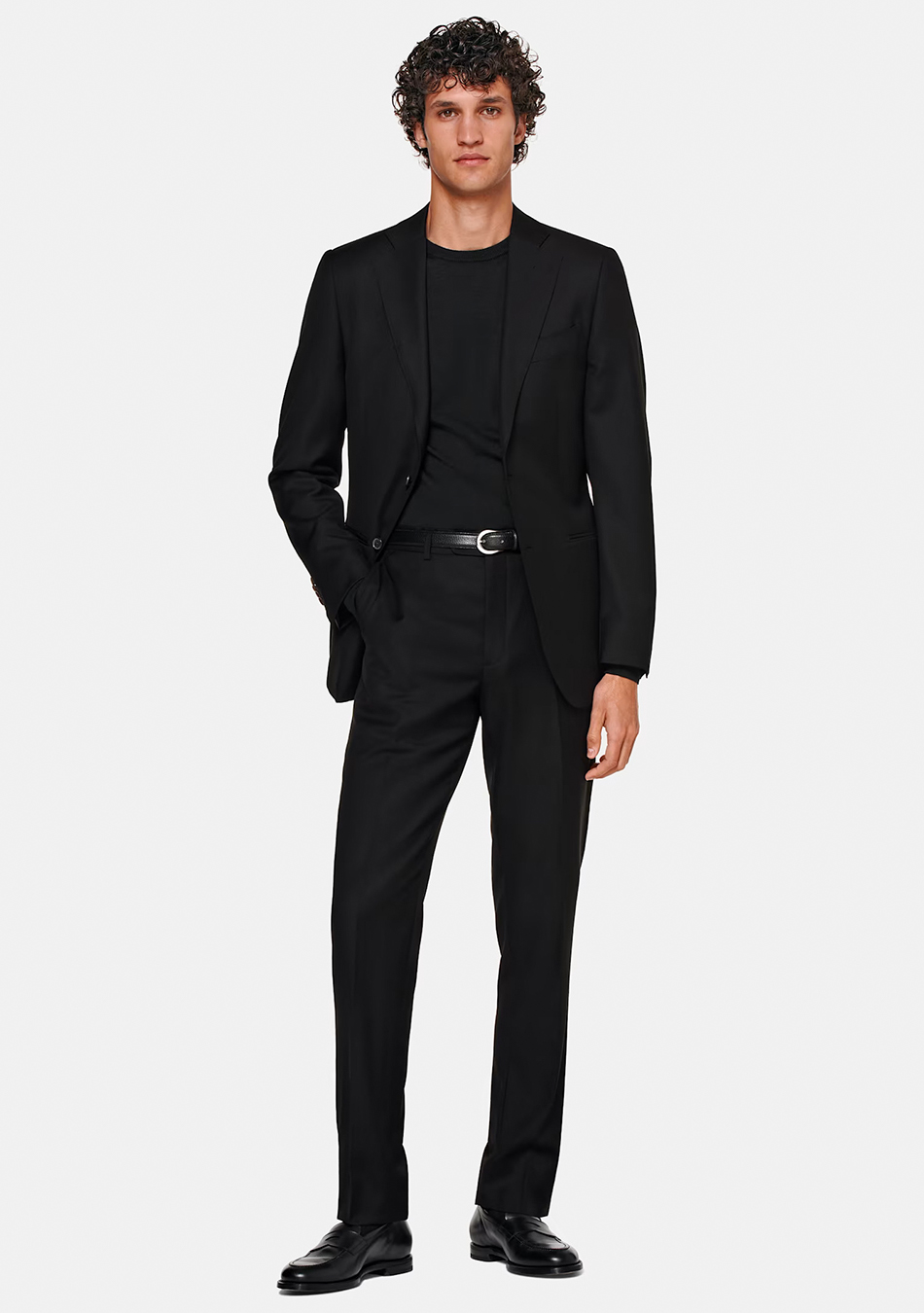 Black suit, black crew neck t-shirt, and black loafers