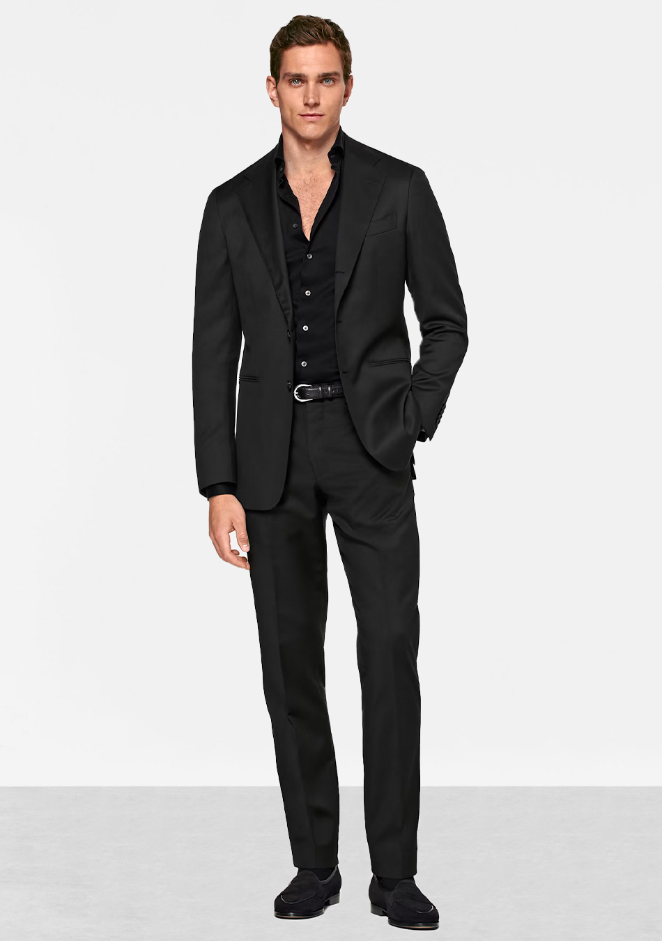 Black suit, black dress shirt, and black loafers