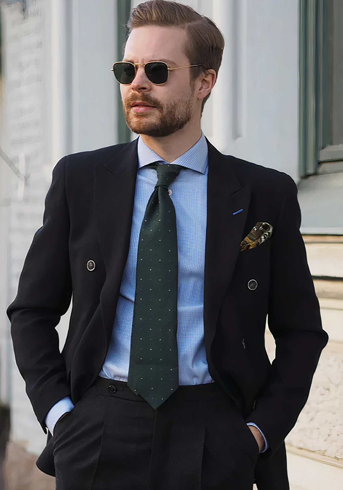 Black suit, blue dress shirt, and green polka dot tie