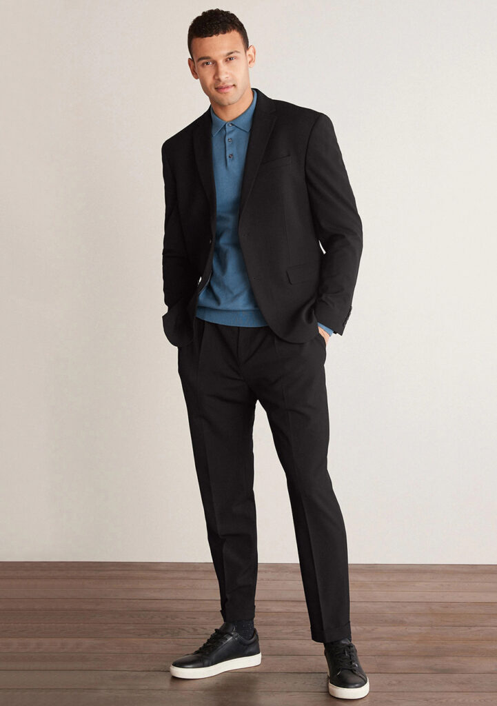 Black suit, blue polo T-shirt, and black sneakers