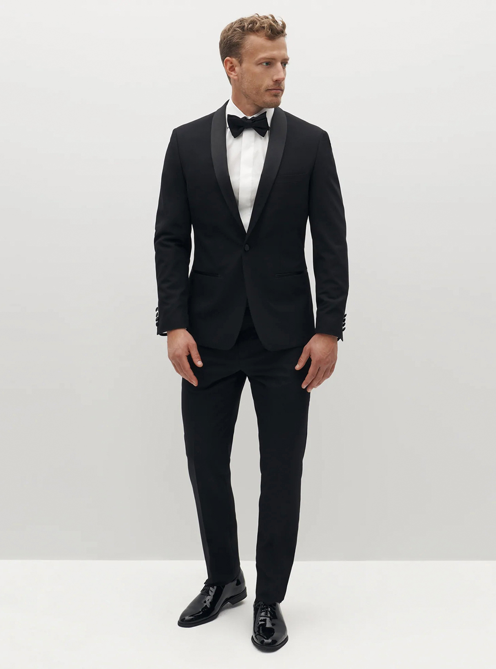 Black tuxedo, white shirt, and black patent leather wholecut Oxfords