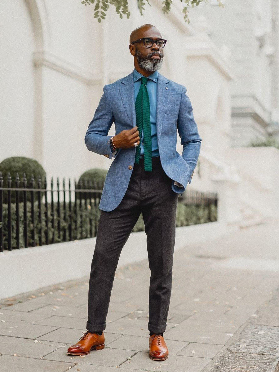 Blue blazer, denim shirt, grey dress pants, and tan oxford shoes