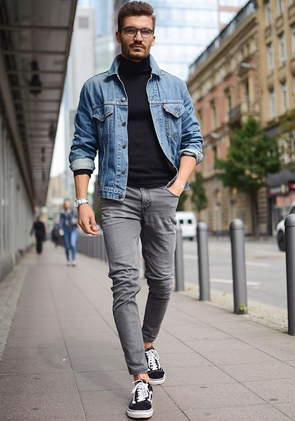 Blue denim jacket, black turtleneck, grey pants, and charcoal sneakers