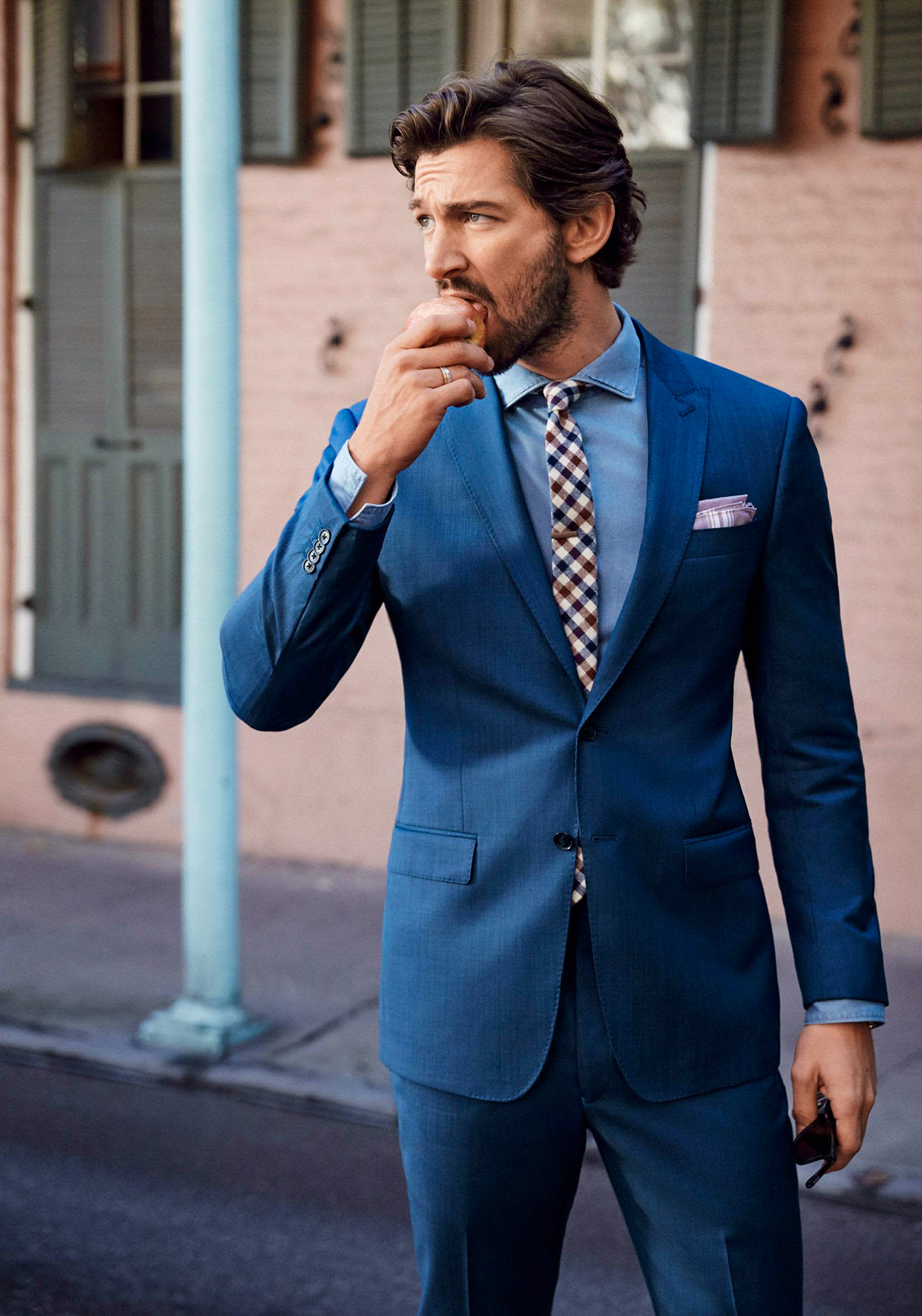 Blue suit, blue shirt, and red/blue plaid tie