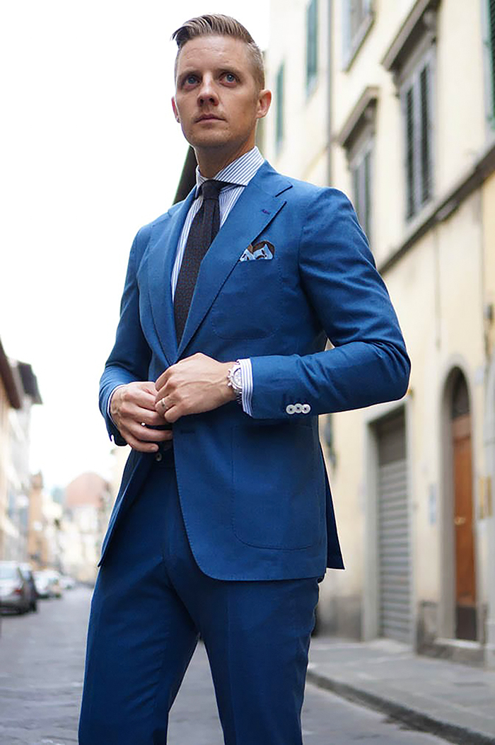 Blue suit, white/blue striped shirt and dark grey tie