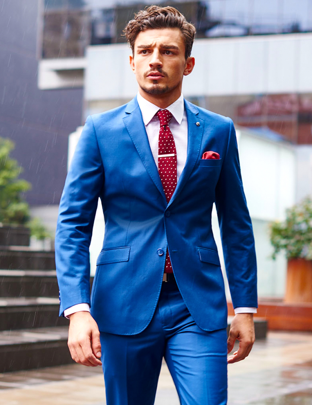 Blue suit, white shirt, and red foulard tie
