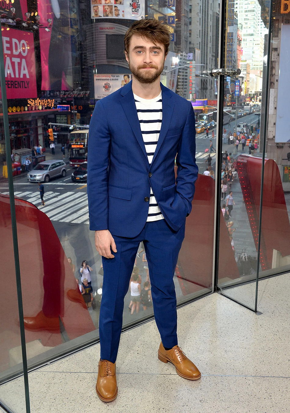 Blue suit, white/navy striped t-shirt, and tan oxford shoes