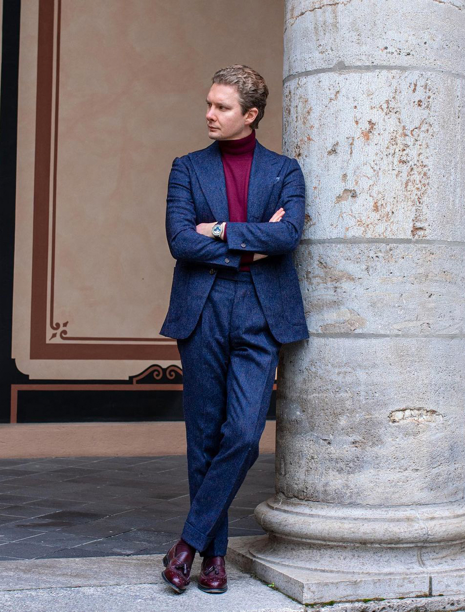 Blue suit with a burgundy turtleneck