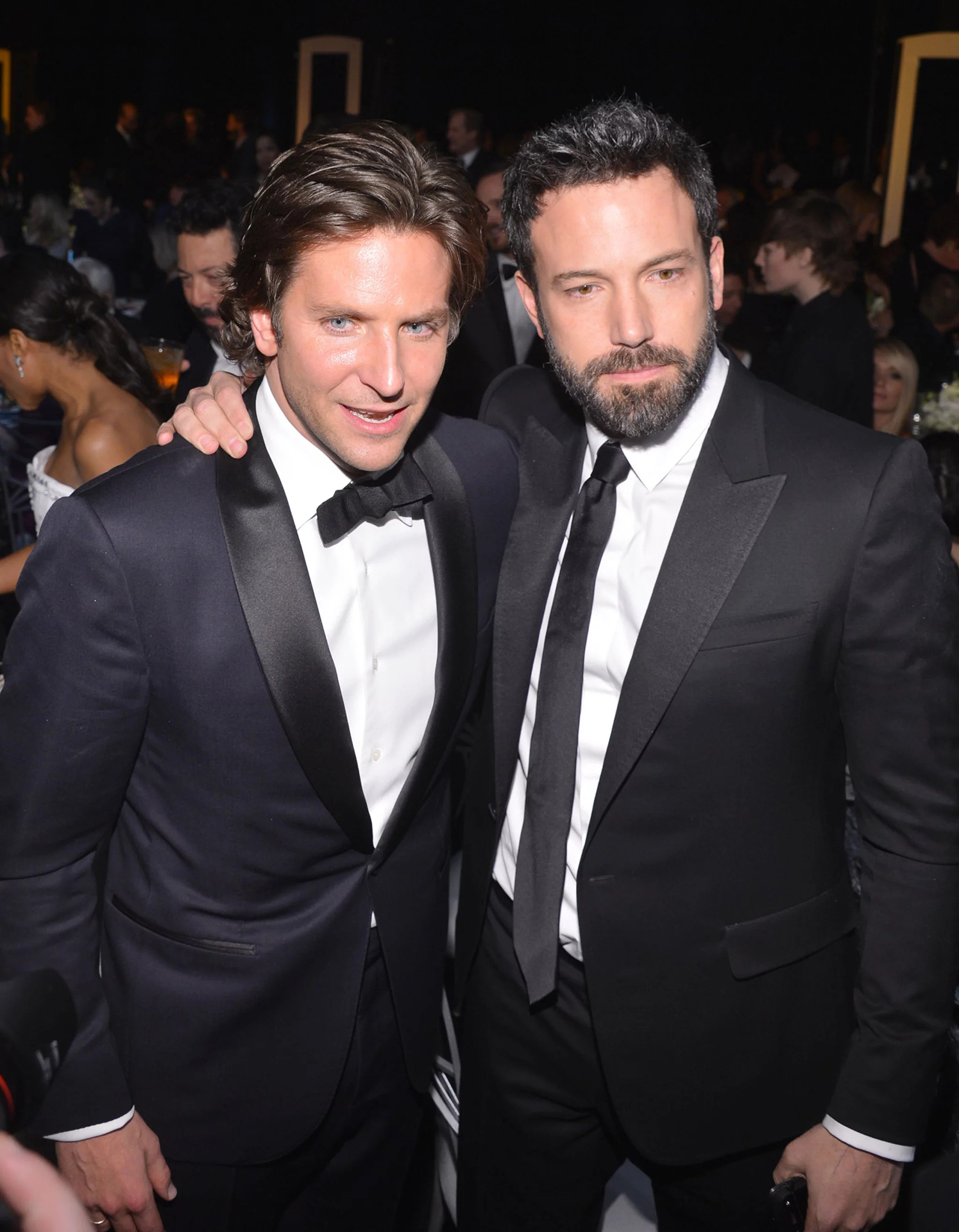 Bradley Cooper and Ben Affleck wearing black-tie attire