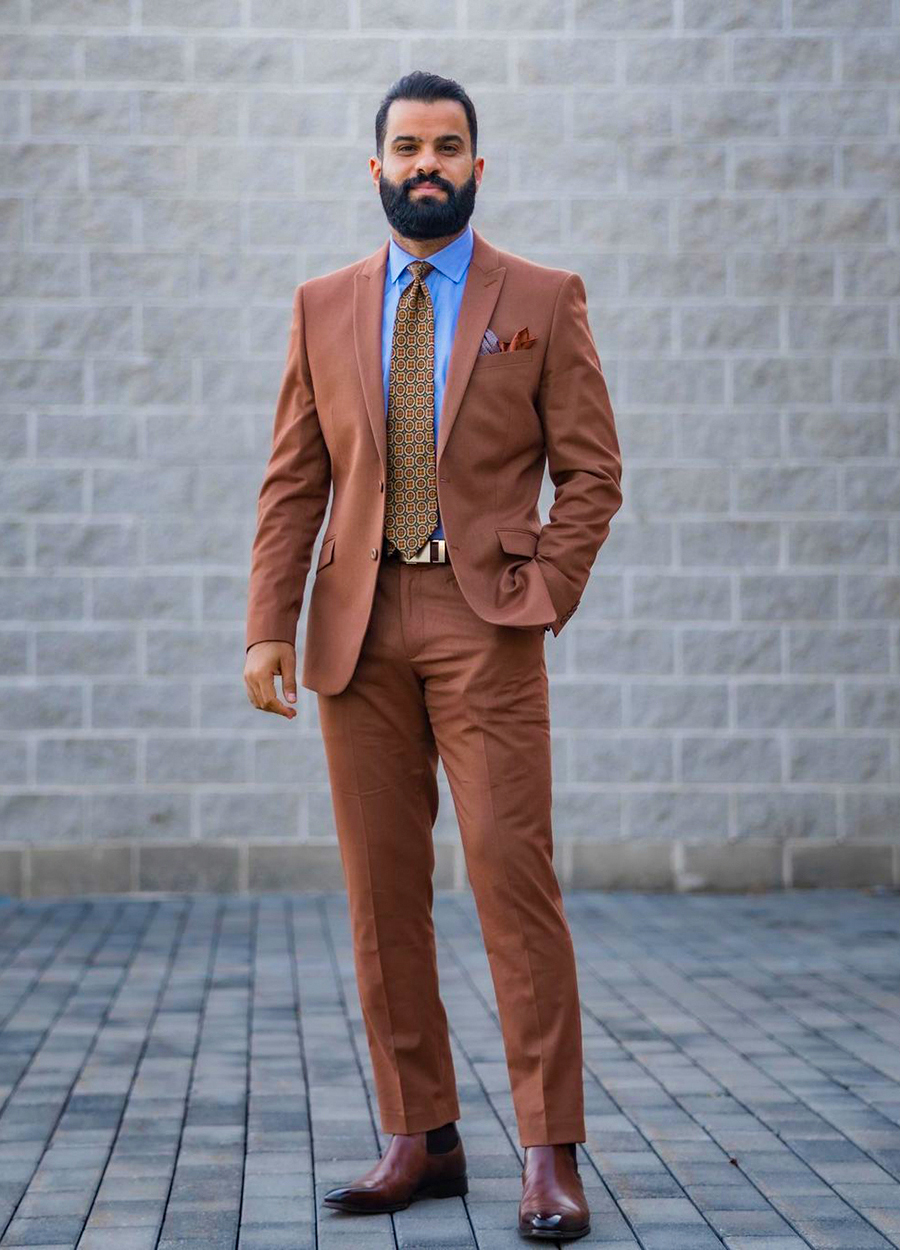 Brown suit, blue shirt, and foulard brown/maroon tie