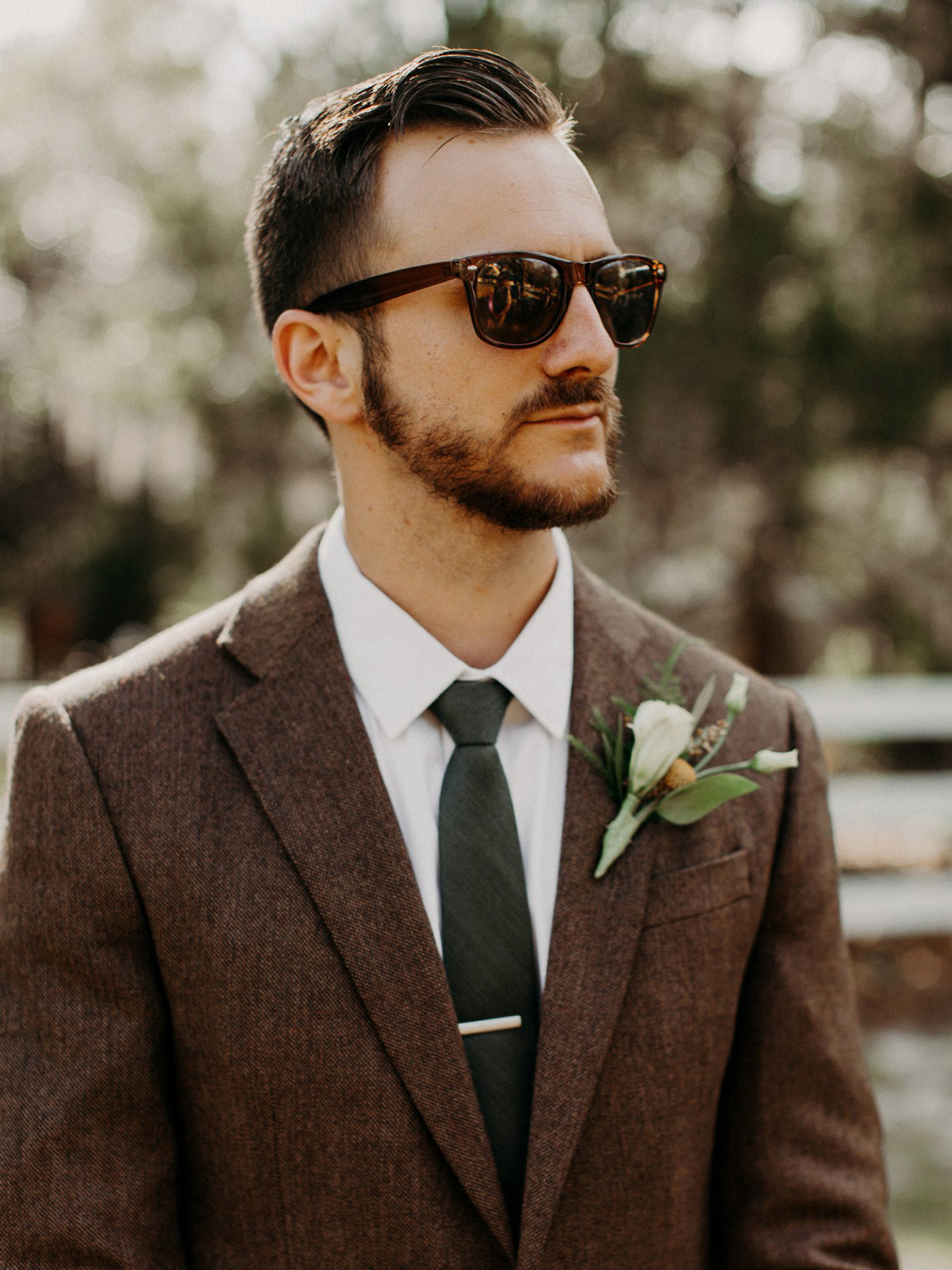Brown suit jacket with white shirt and green tie for wedding