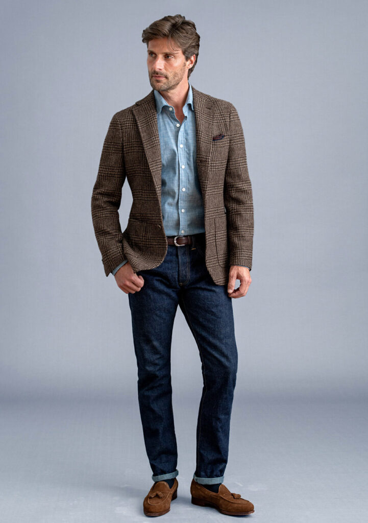 brown tweed blazer, light blue denim shirt, indigo jeans, and brown suede loafers