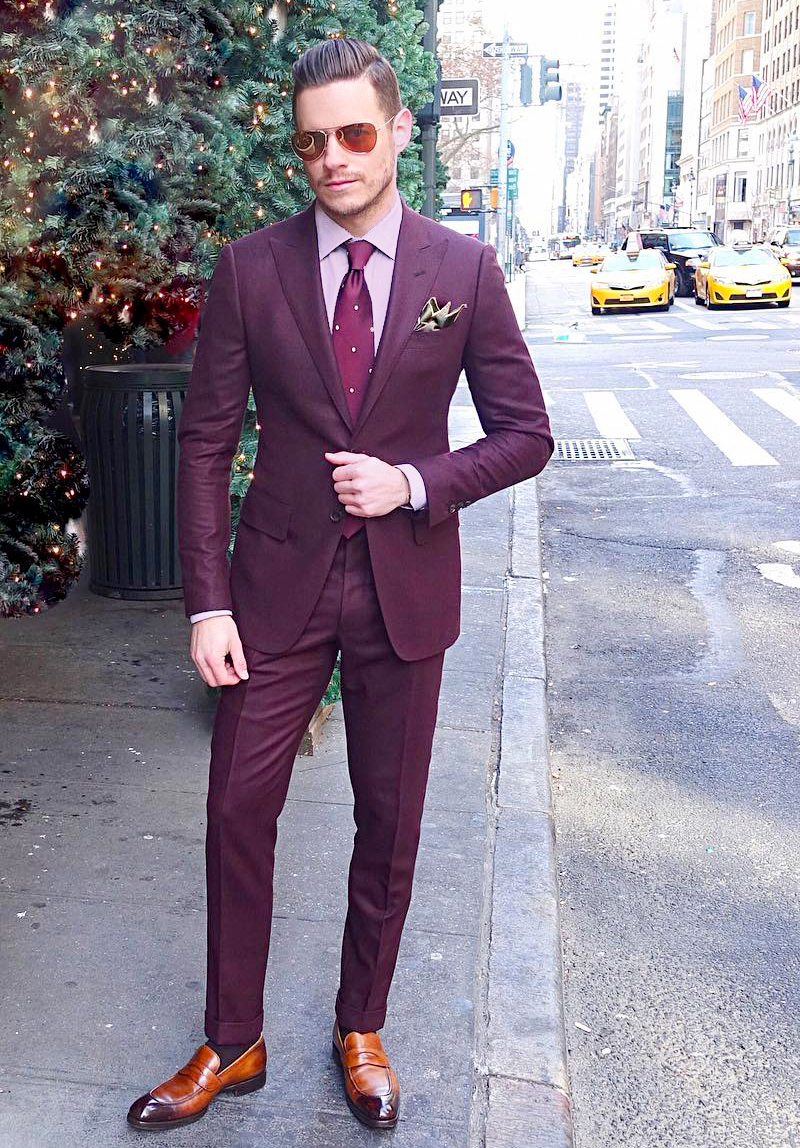 Burgundy suit, light pink dress shirt, and marron dotted tie