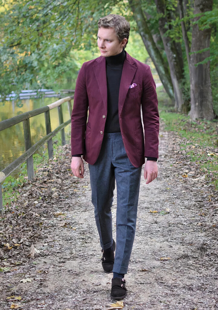 Burgundy blazer, black turtleneck, grey pants, and brown suede monk straps