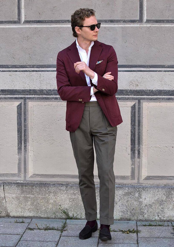 Burgundy blazer, white shirt, grey pants, and black suede loafers