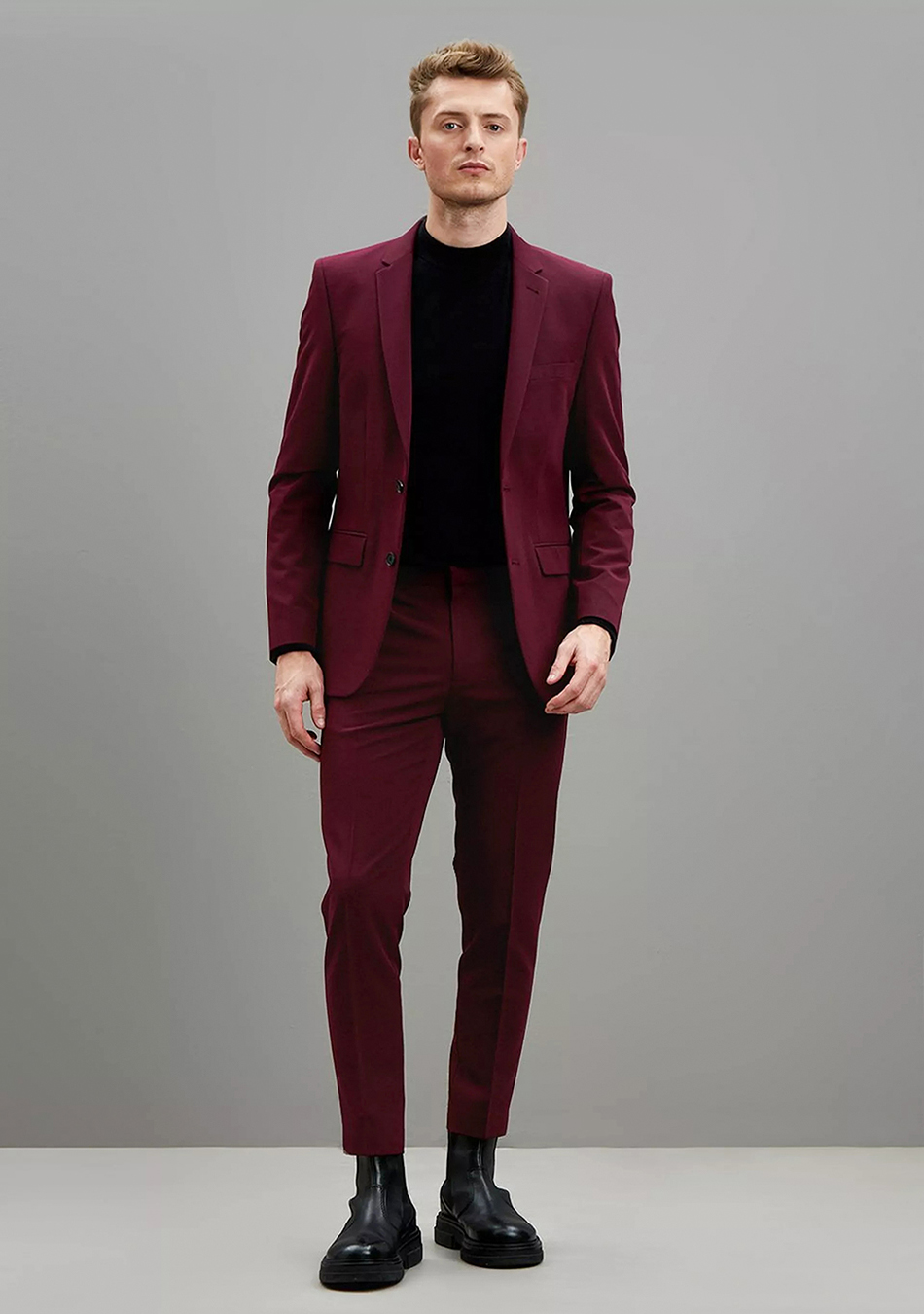 Burgundy suit, black long-sleeve t-shirt, and black combat boots