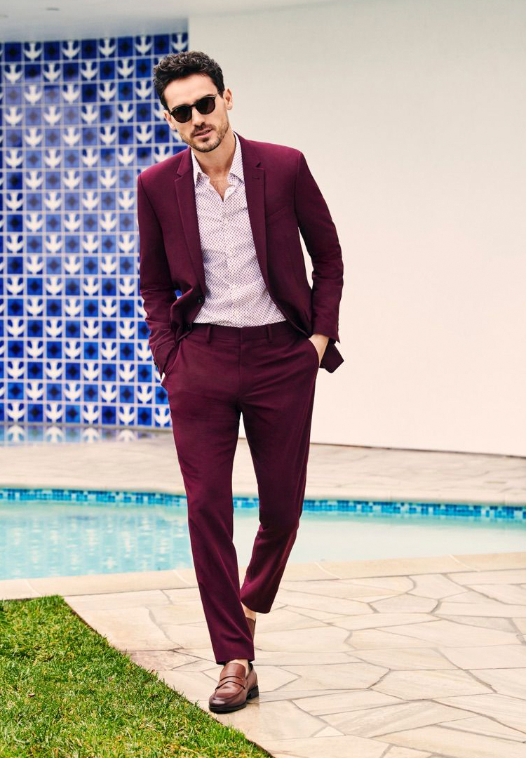Wearing a burgundy suit with a pink patterned shirt