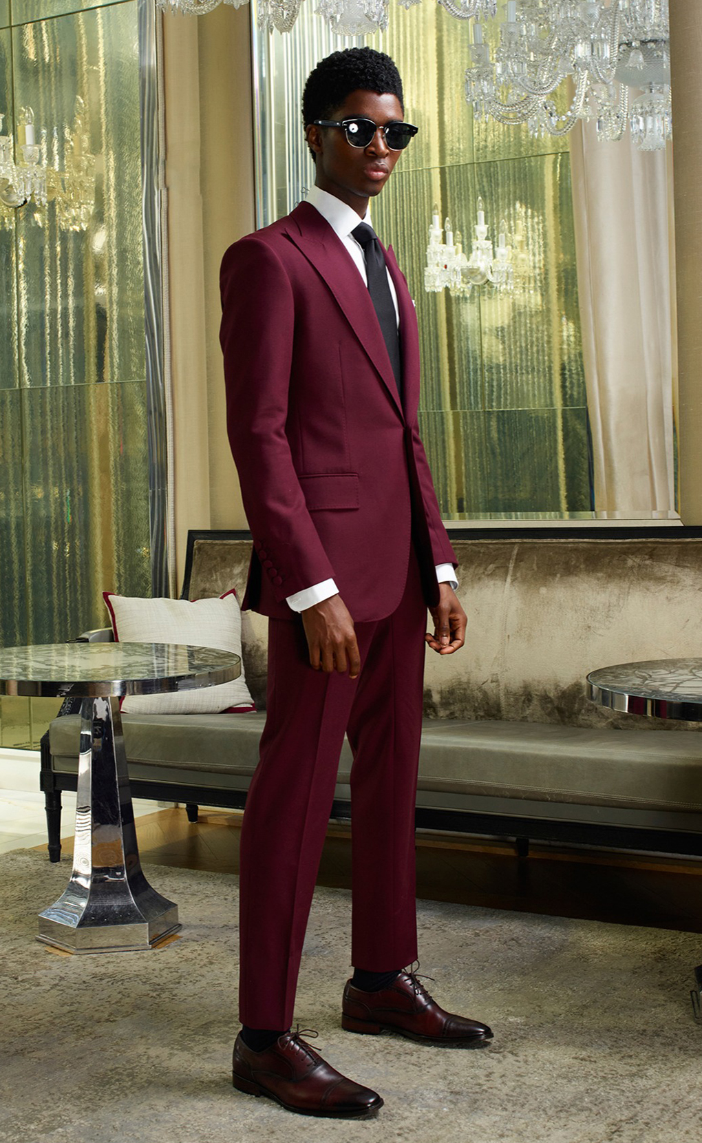 Burgundy suit, white shirt, and black solid tie