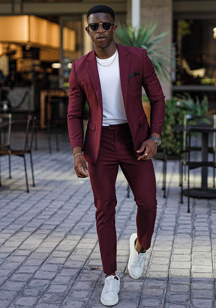 Burgundy suit, white t-shirt, and white low-top sneakers