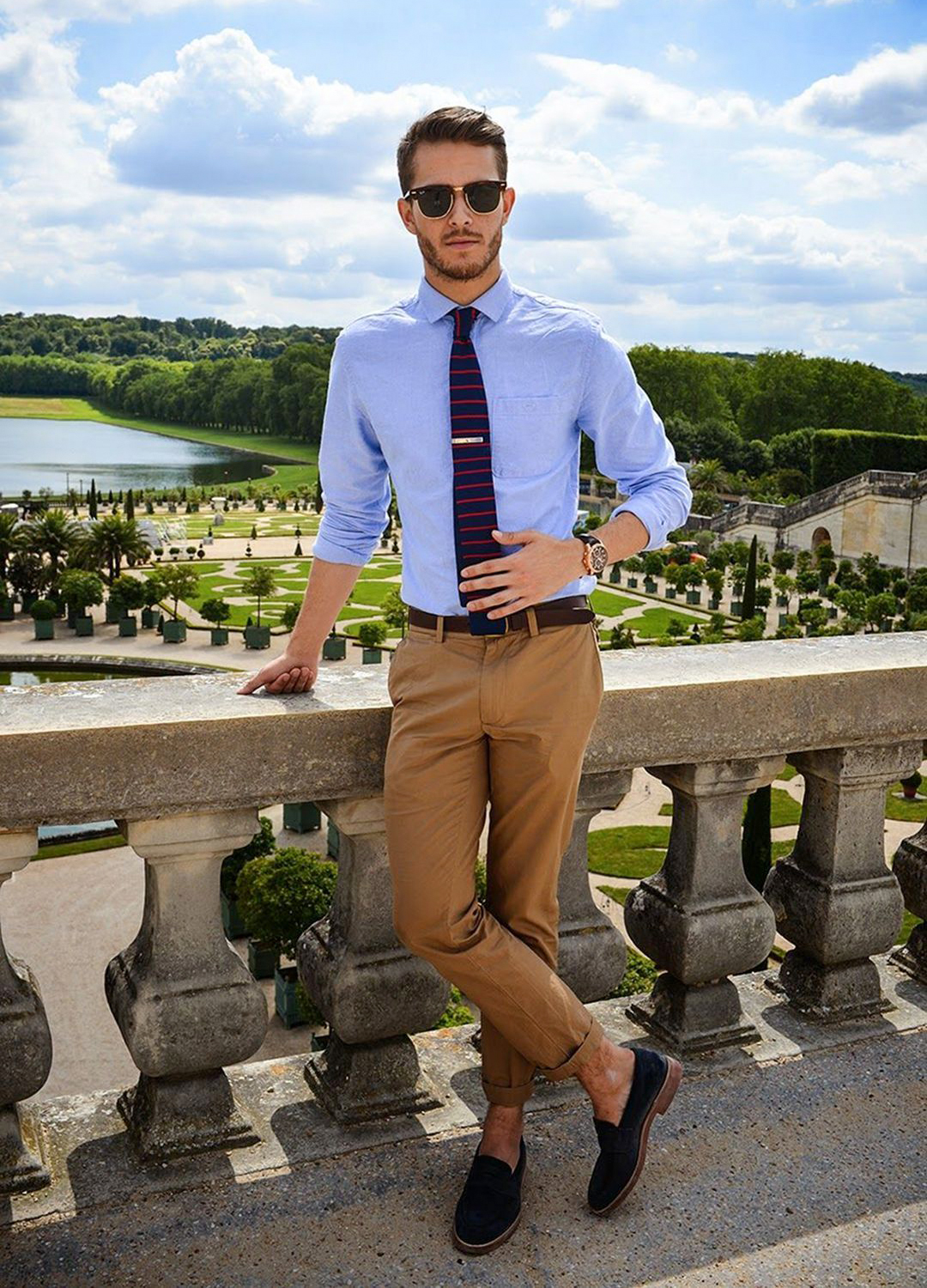 Business casual outfit: blue shirt, khaki pants, and navy/red patterned tie