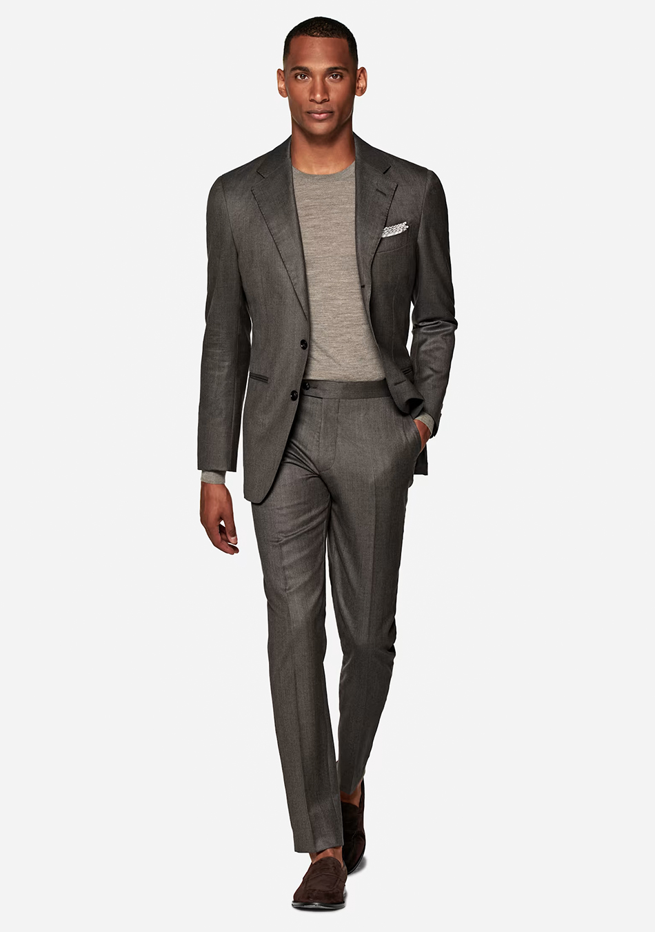 Charcoal grey houndstooth suit, grey t-shirt, and brown loafers