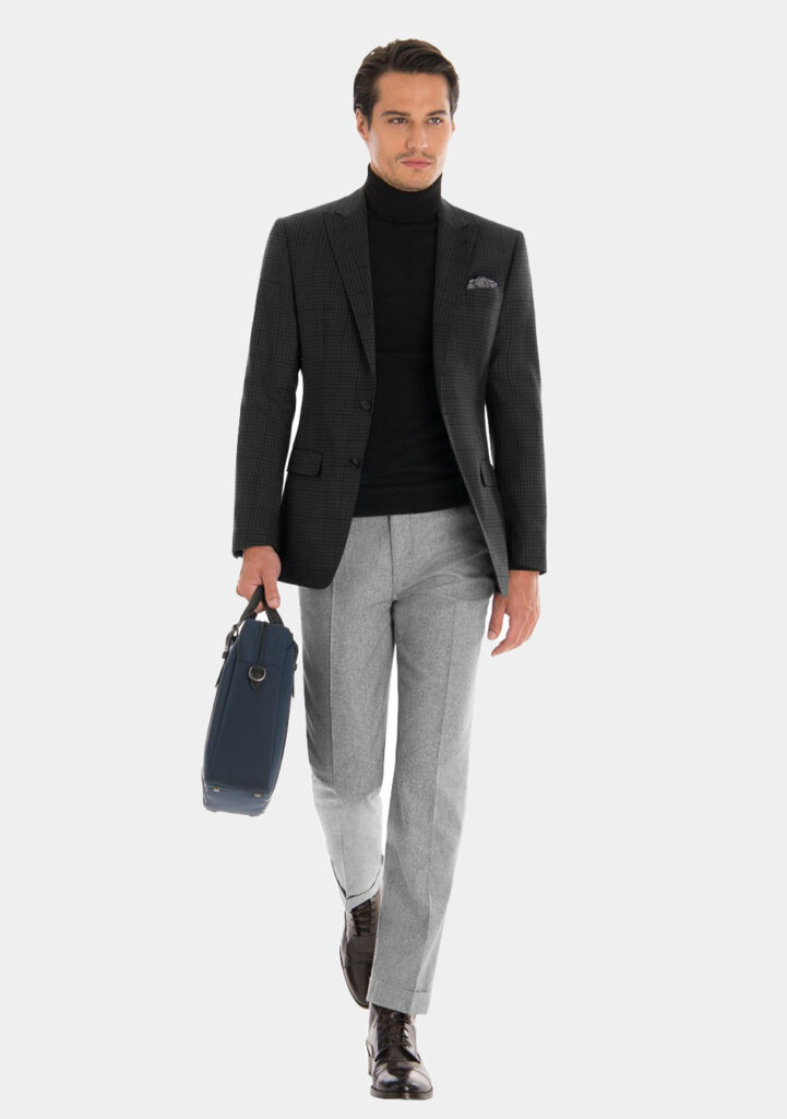 Charcoal plaid blazer, black turtleneck, grey pants, and brown dress boots