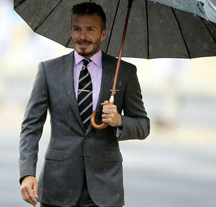 David Beckham wears charcoal suit and pink shirt color combination
