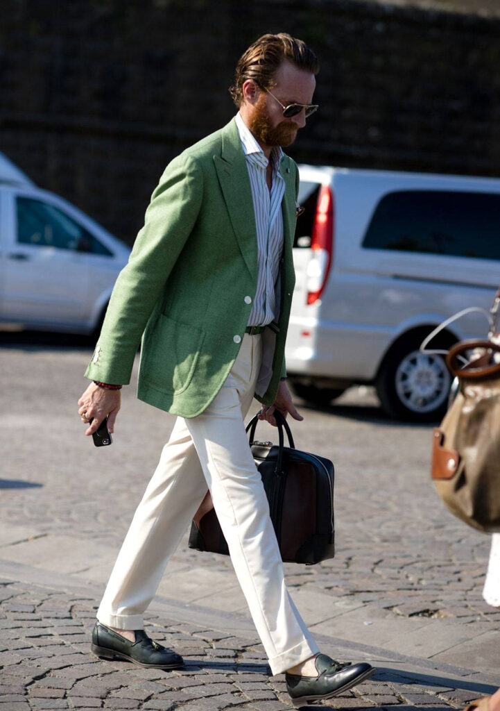 green blazer white striped shirt beige pants and olive green loafers