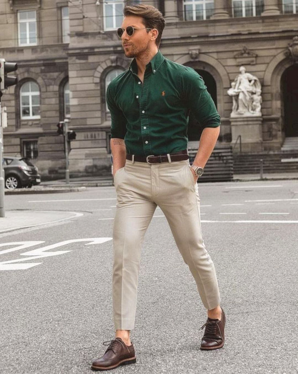 Green shirt, tan pants, brown loafers, and brown belt