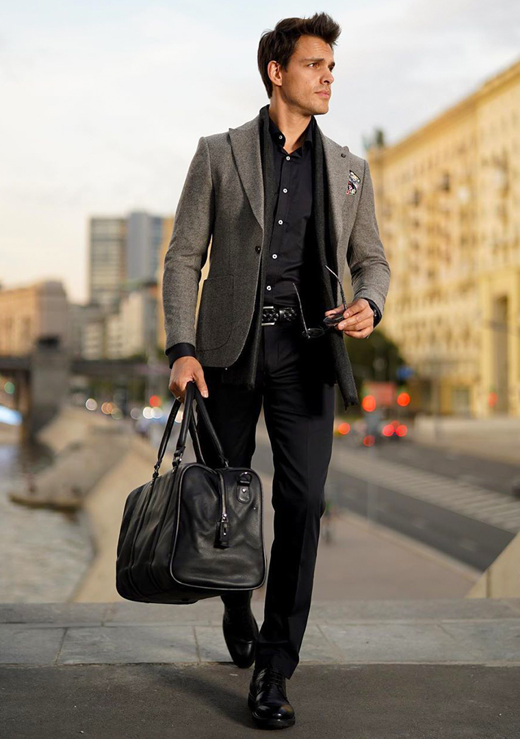 Grey blazer, black dress shirt, black dress pants, and black leather derbies