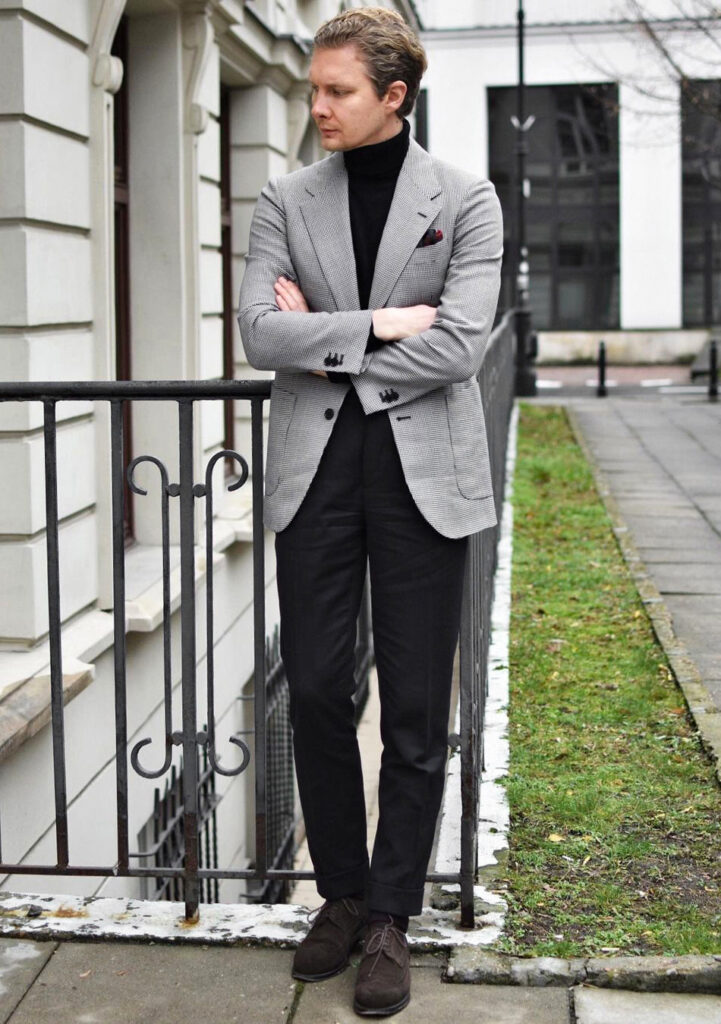 Grey blazer and black pants with a black turtleneck
