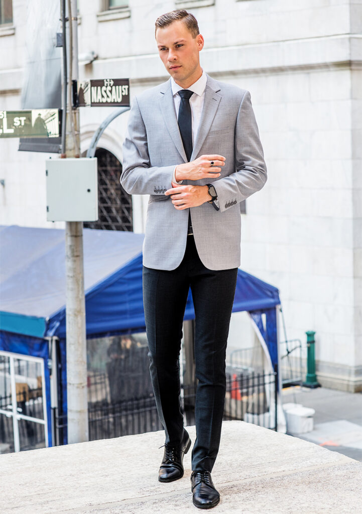 Grey blazer, white dress shirt, and black pants