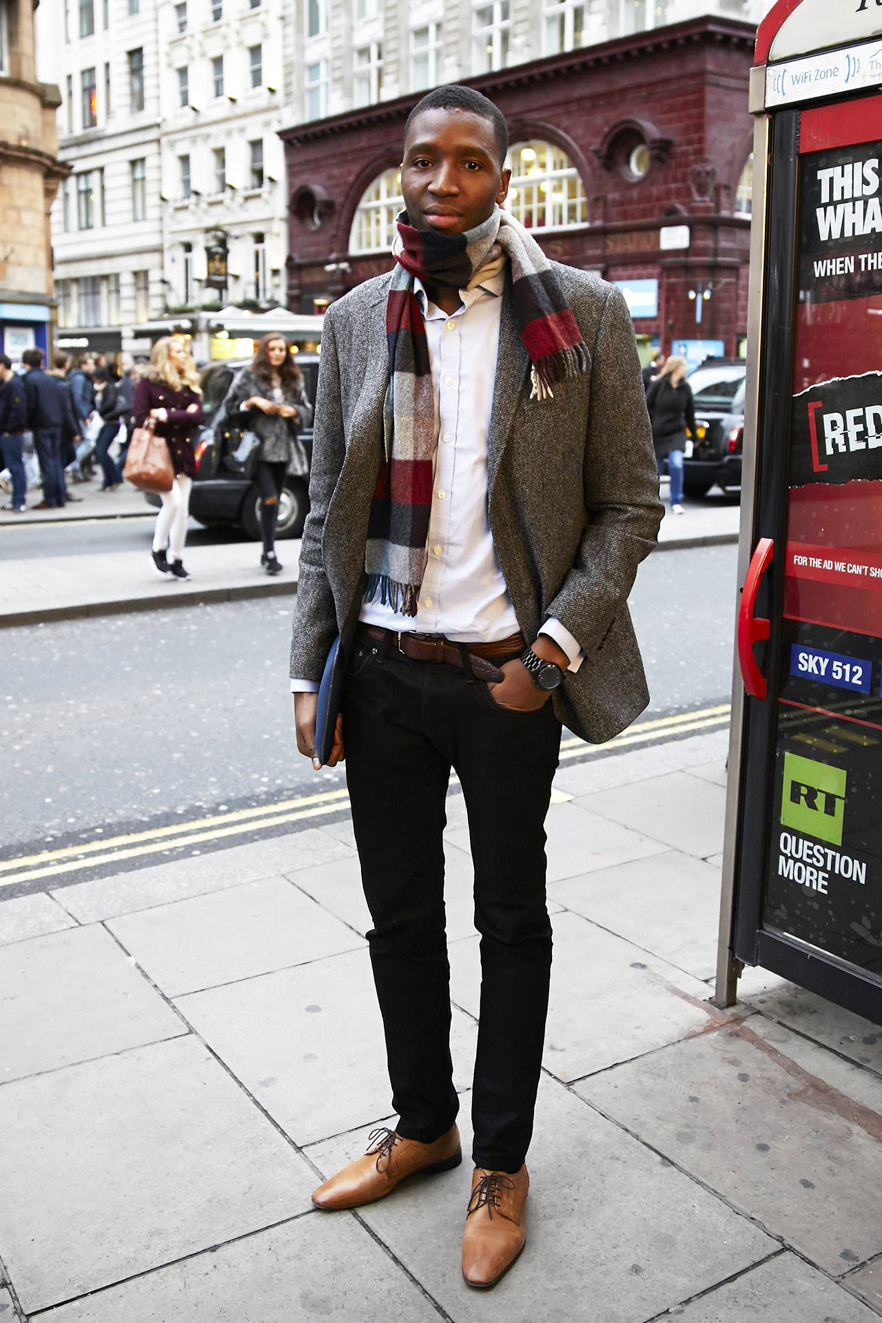 Grey blazer, white shirt, black jeans, and brown derby shoes