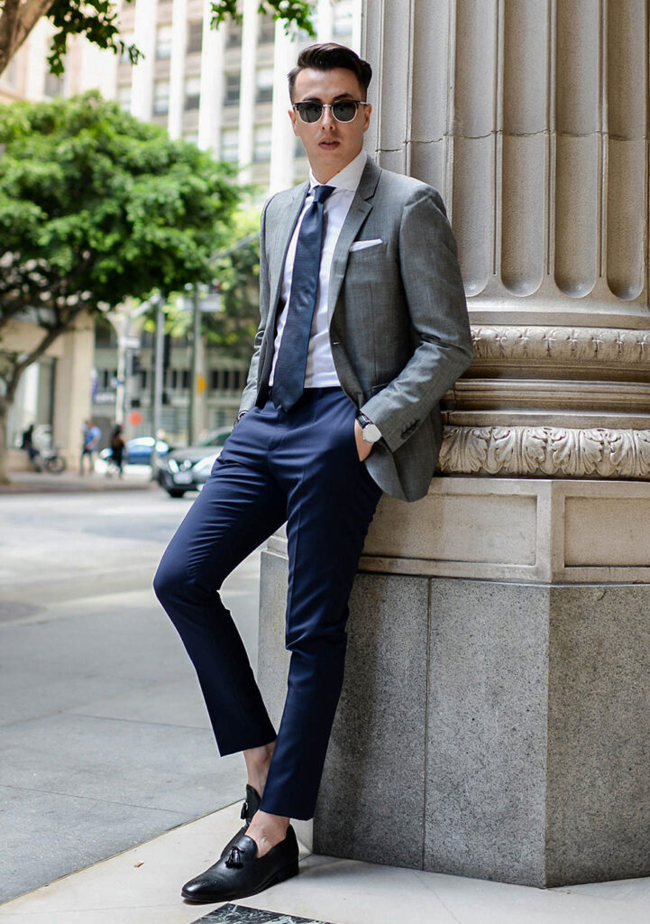 Grey blazer, white shirt, and navy pants