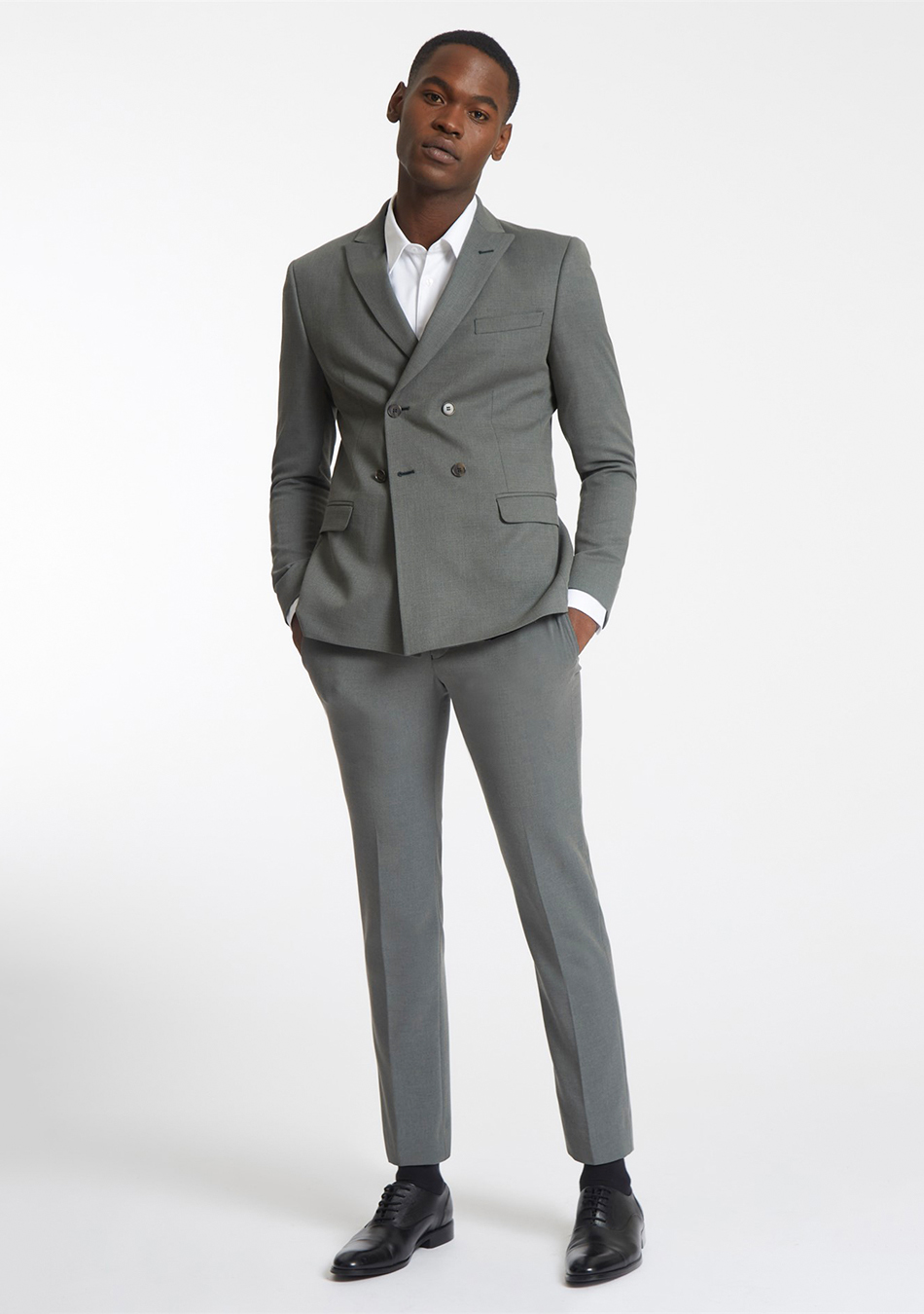 Grey double-breasted suit, white dress shirt, and black brogue shoes