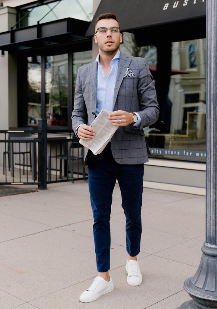 Grey plaid blazer, blue dress shirt, navy pants, and white sneakers