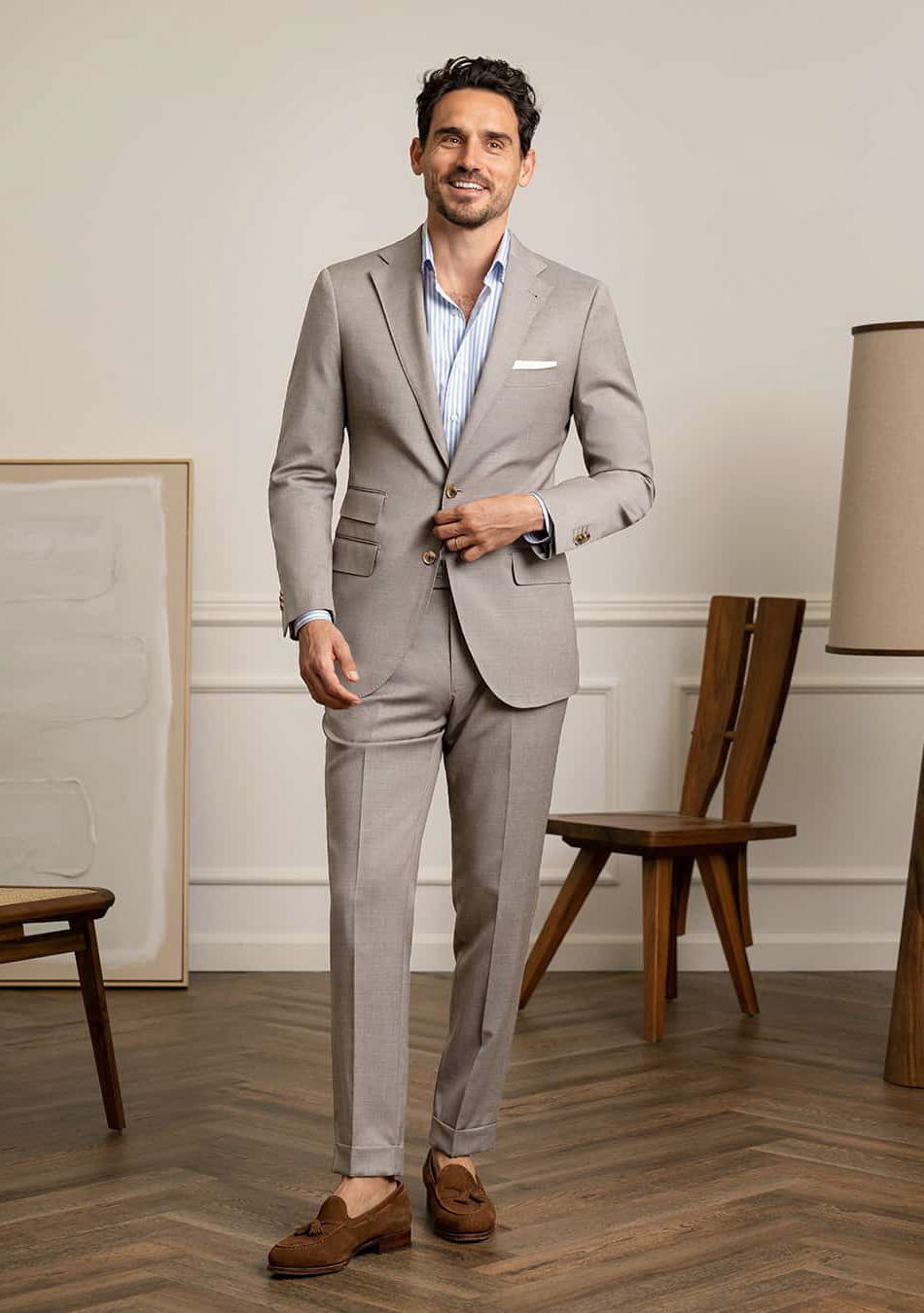 Grey suit, blue dress shirt, and tan suede loafers