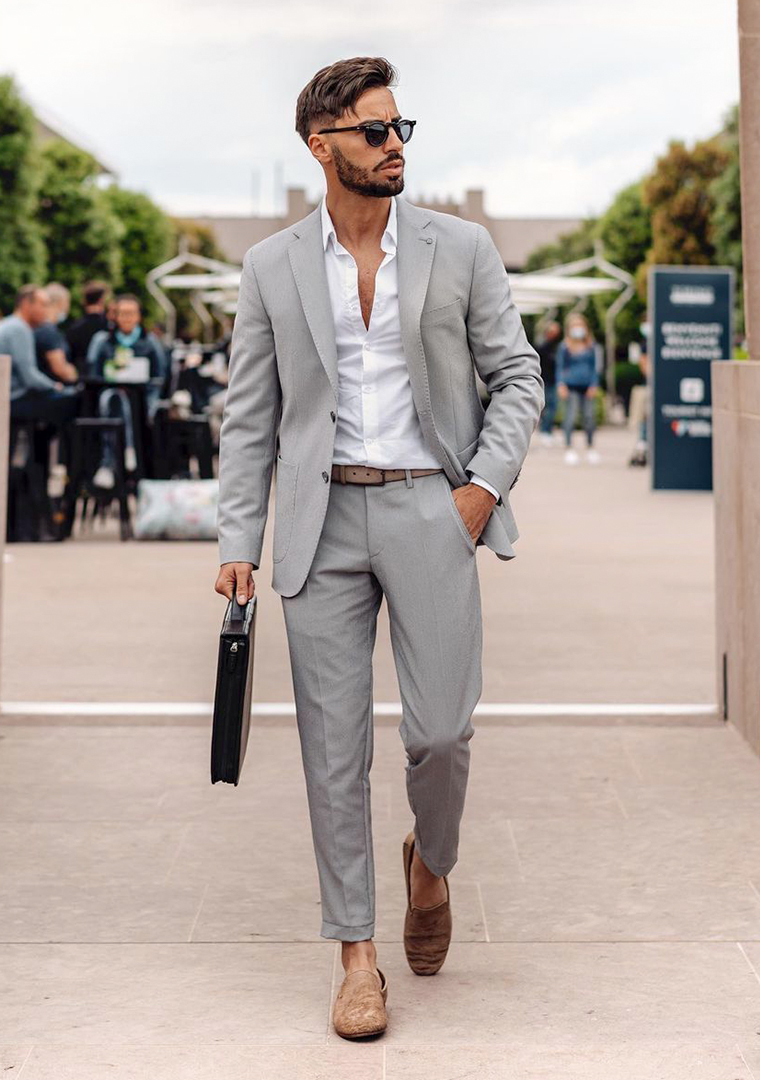 Grey suit, white dress shirt, and tan canvas loafers