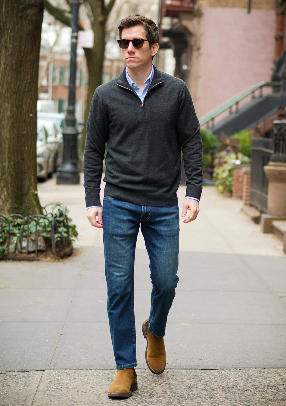 Grey sweater, blue shirt, blue jeans, and brown suede Chelsea boots