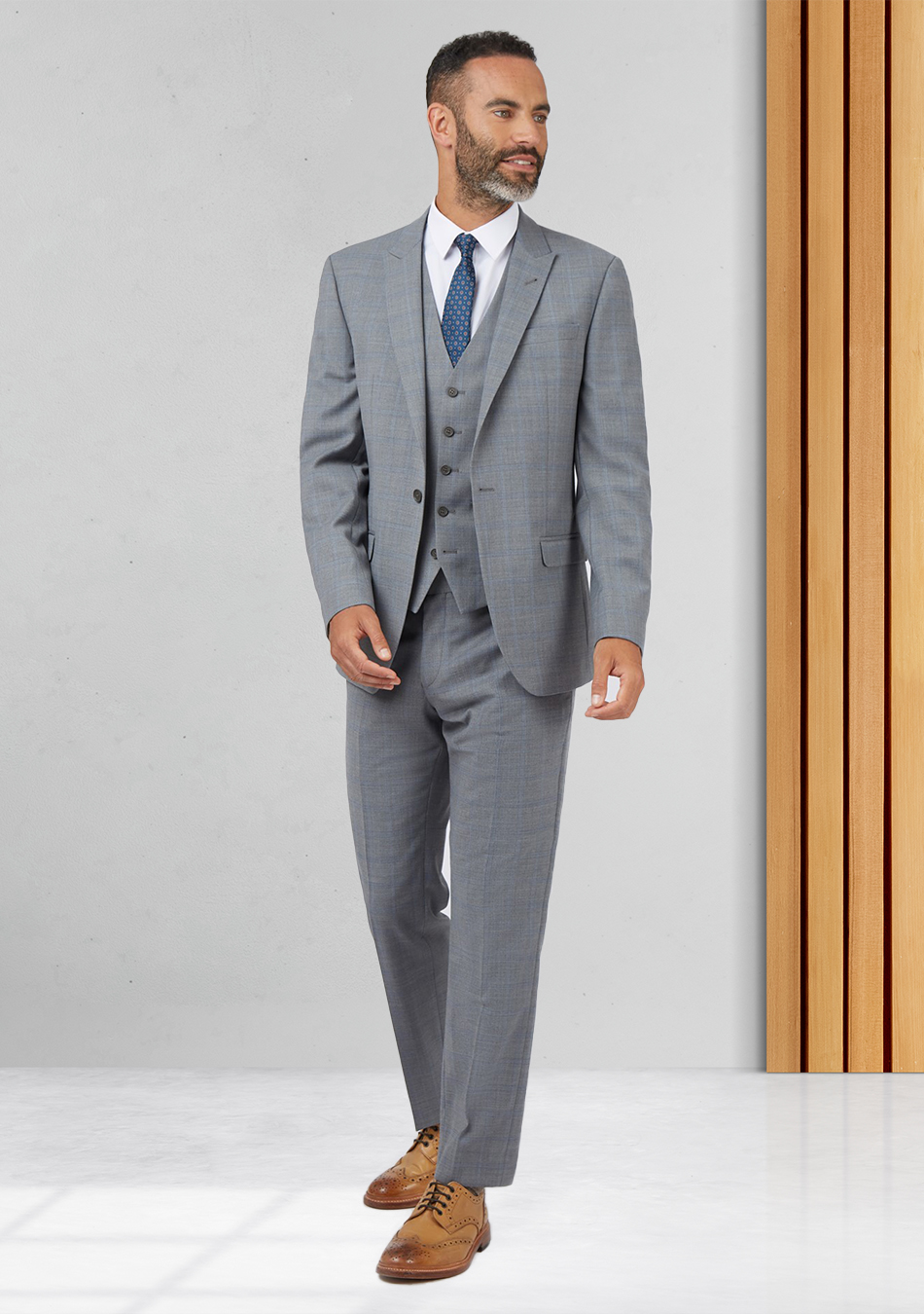 Grey three-piece suit, white shirt, and tan derby shoes