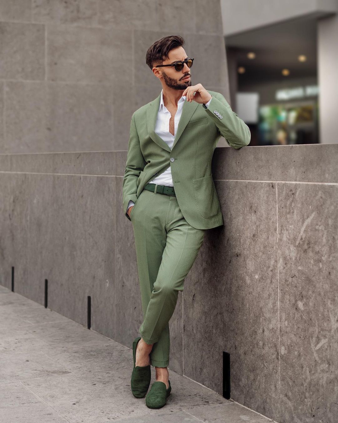 Wearing a green suit casually