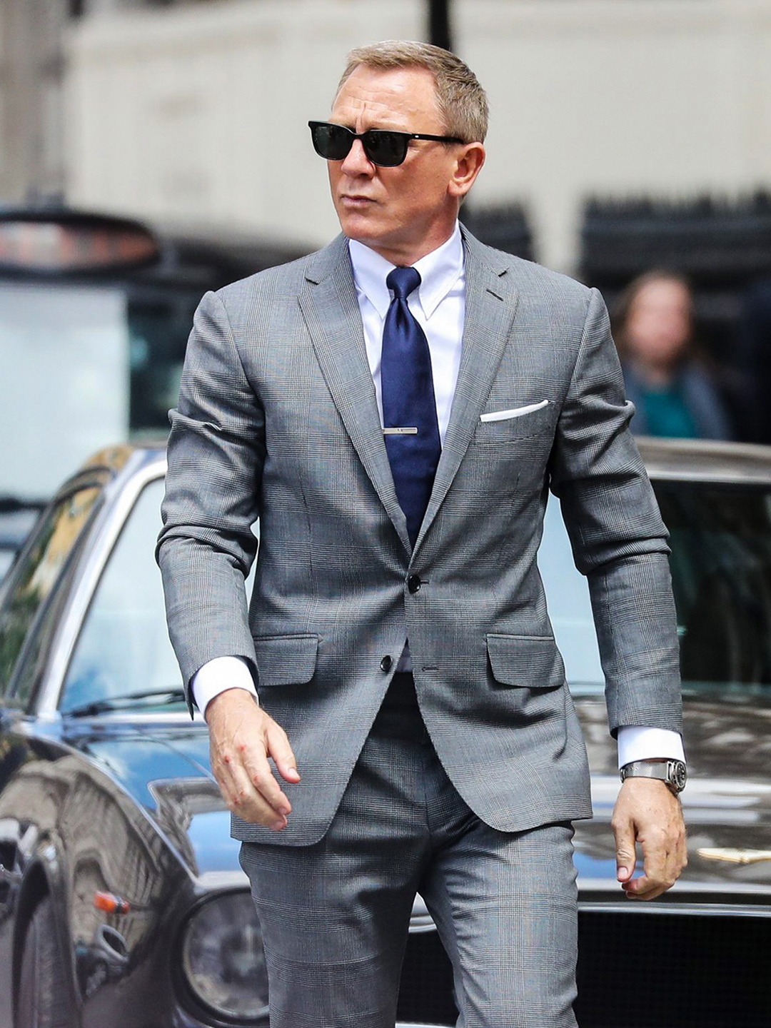 James Bond wearing a light-grey suit