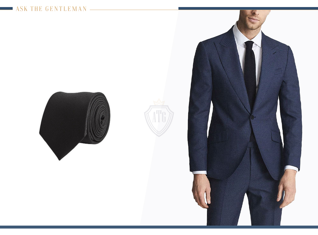 How to wear a navy suit with a black tie