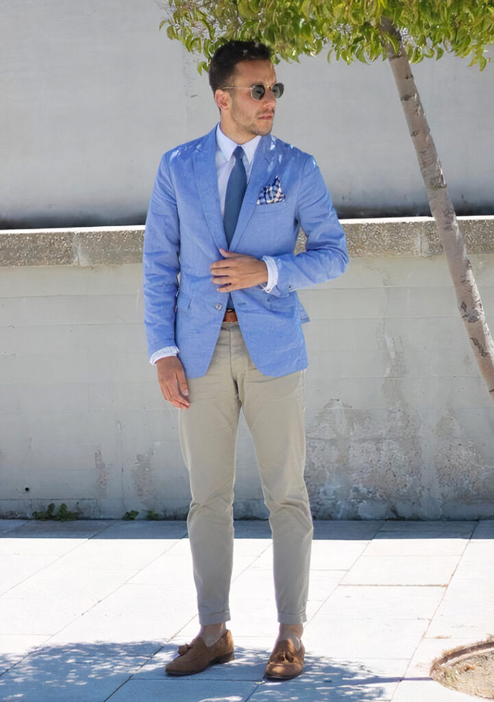 Light blue blazer, white shirt, brown loafers, and tan pants