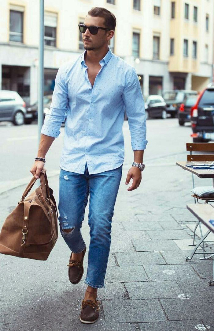 Light blue shirt, blue jeans, and brown boat shoes