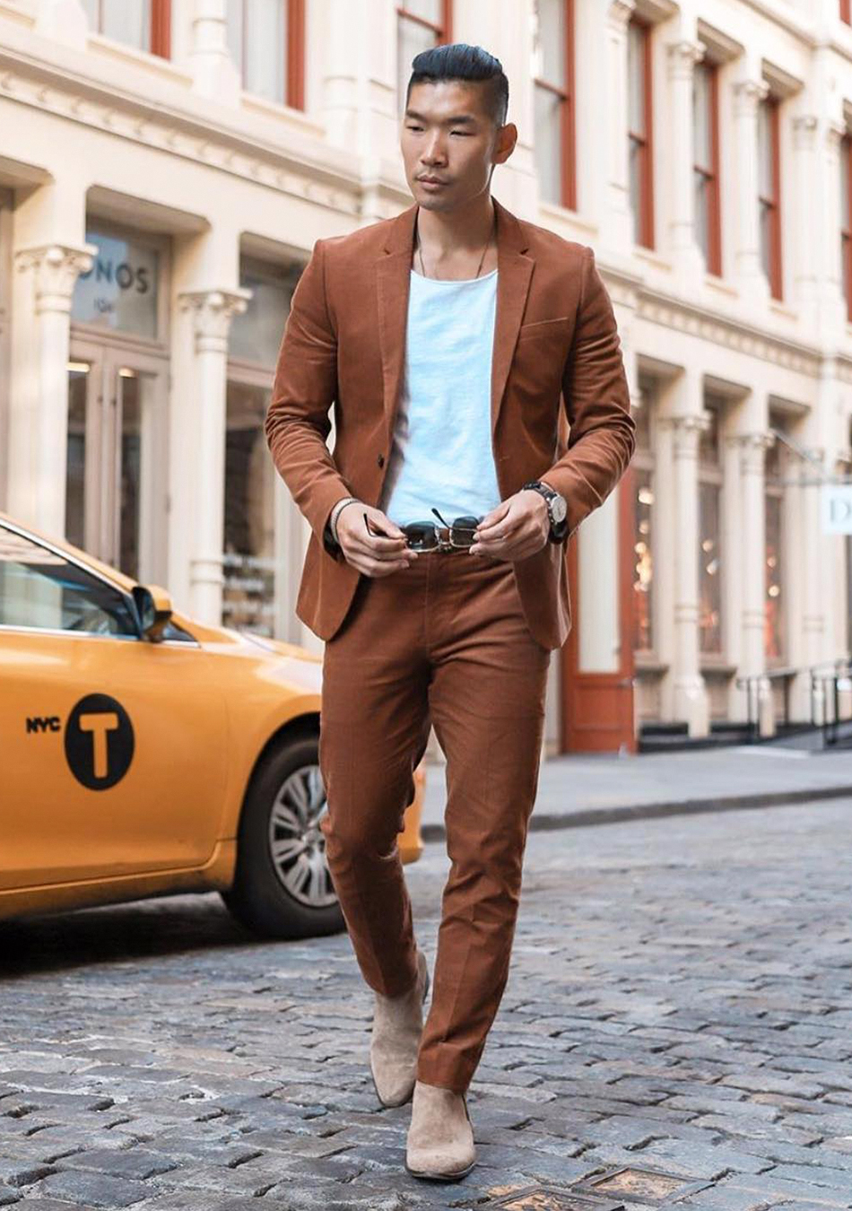 Brown suit, white t-shirt, and tan suede Chelseas