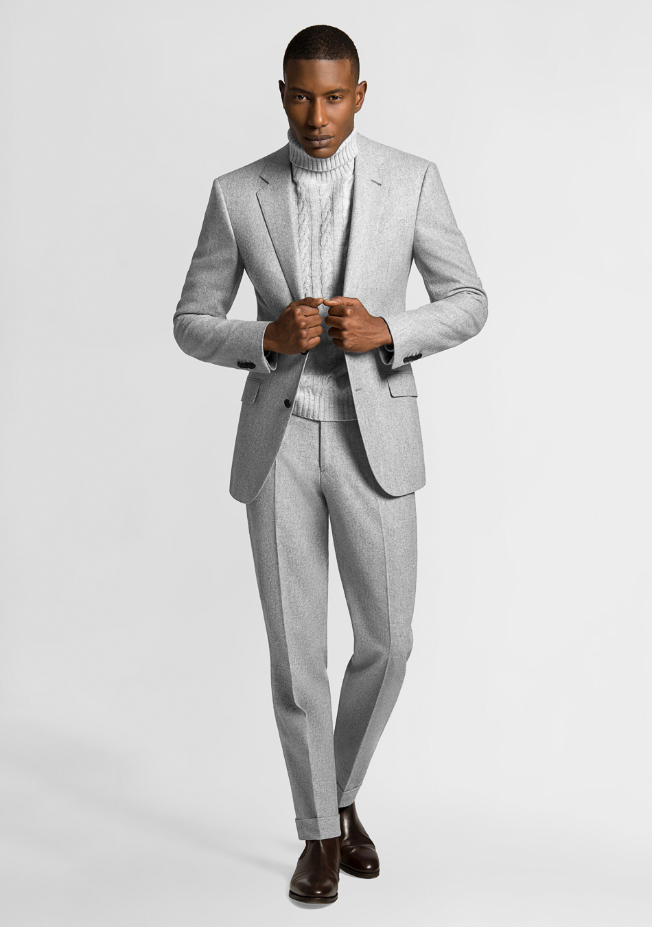 Wearing a light grey flanner suit with a biege turtleneck