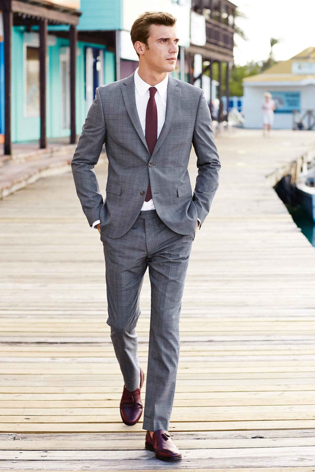 Burgundy loafers with a light gray suit and white shirt